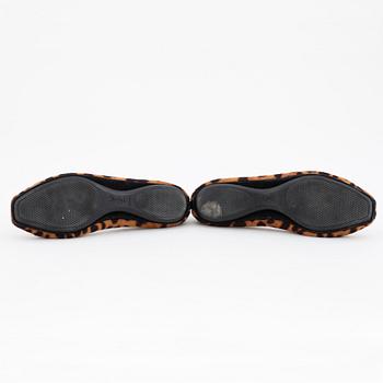 YVES SAINT LAURENT, a pair of leopard haired leather ballet flats.
