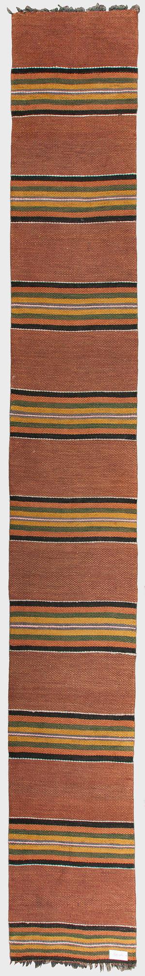 A 1930/1940s rag rug /runner. Circa 550 x 74 cm.
