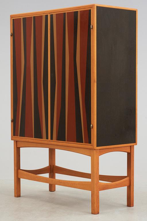 A Curt Blomberg mahogany cabinet, the doors, sides and top with painted panels, ca 1954.