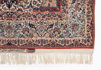 A semi-antique Isfahan rug, signed (Sadegh) Seirafian, c. 244 x 149 cm.