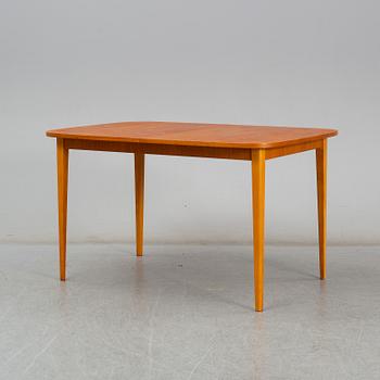 A second half of the 20th century teak veneered dining table.