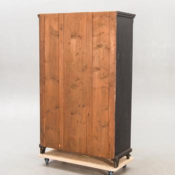 A painted early 1900s display cabinet.