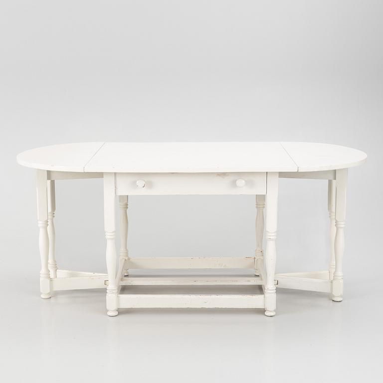 An early 20th century drop-leaf table.