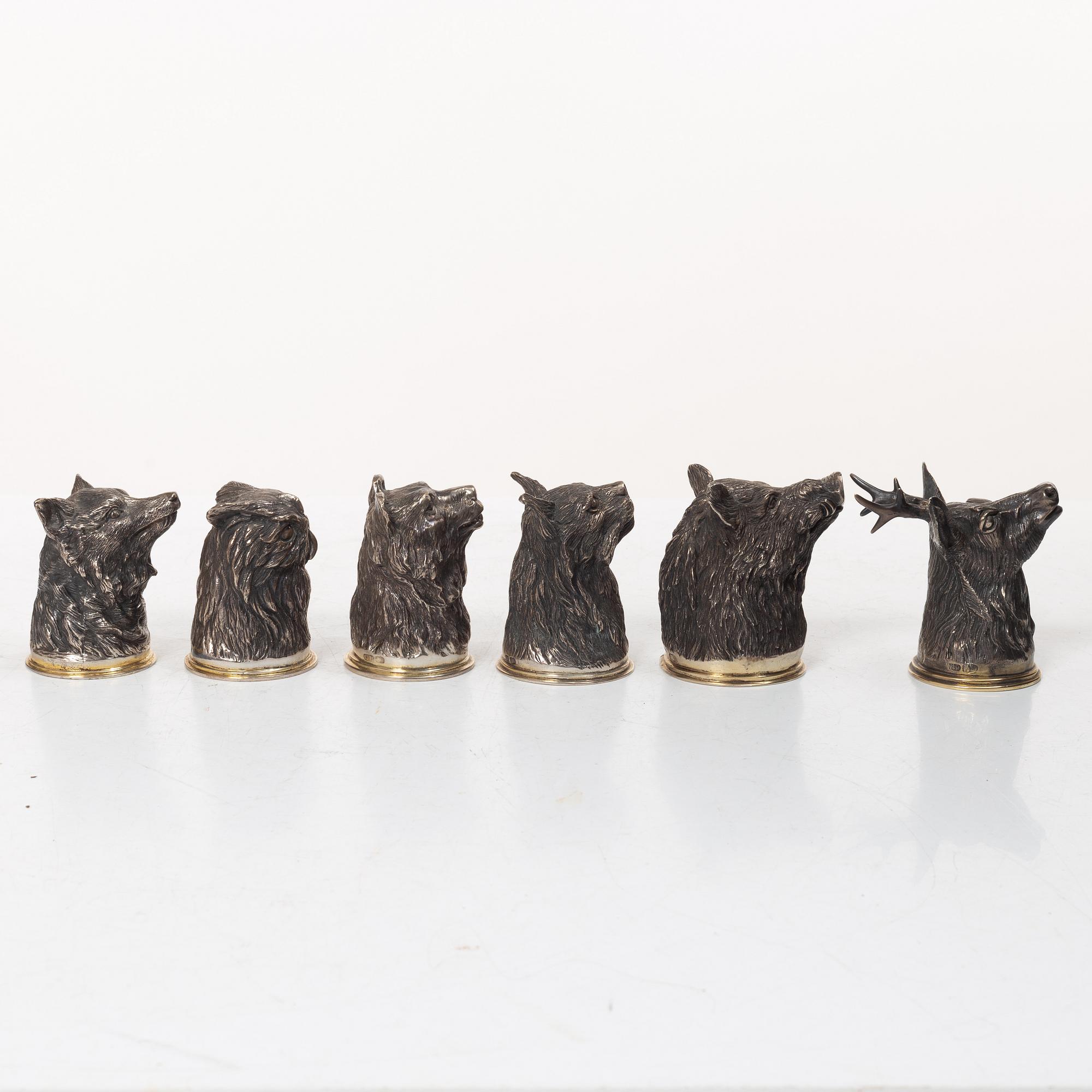 Six Russian parcel-gilt silver animal's head stirrup cups, including with mark of Nikols & Plinke, St. Petersburg.