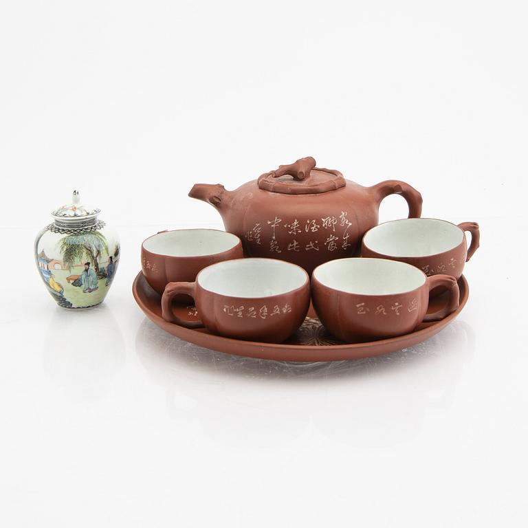 A Chinese 20th century Yixing ware tea service and a porcelain tea caddie.
