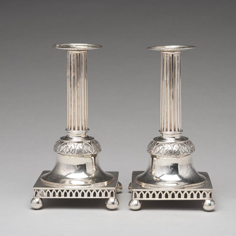 A pair of Swedish aerly 19th century silver candlesticks, mark of Carl Gustaf Blomborg, Stockholm 1815.