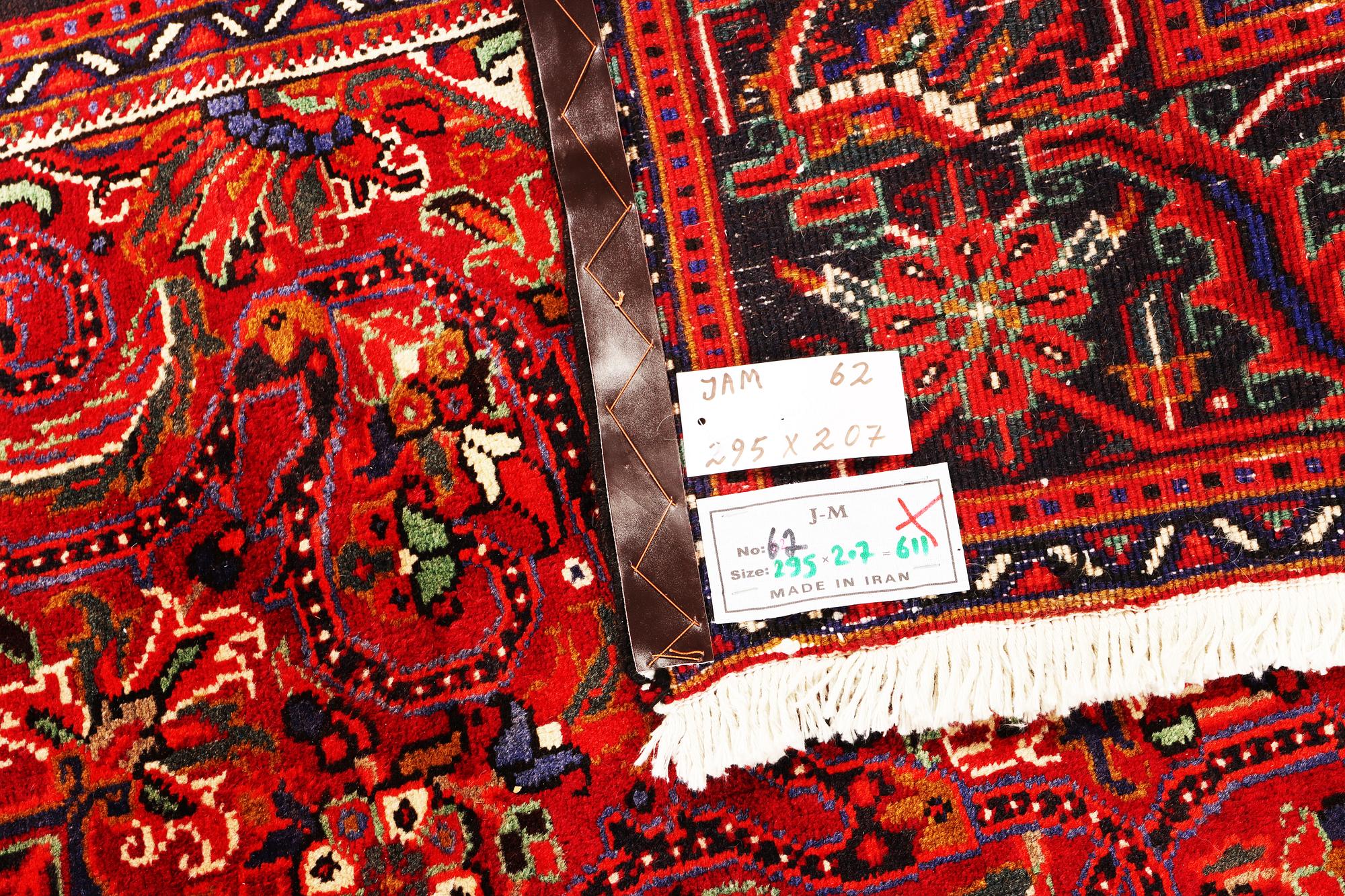 A Heriz patternd carpet, a.  295 x 207 cm.