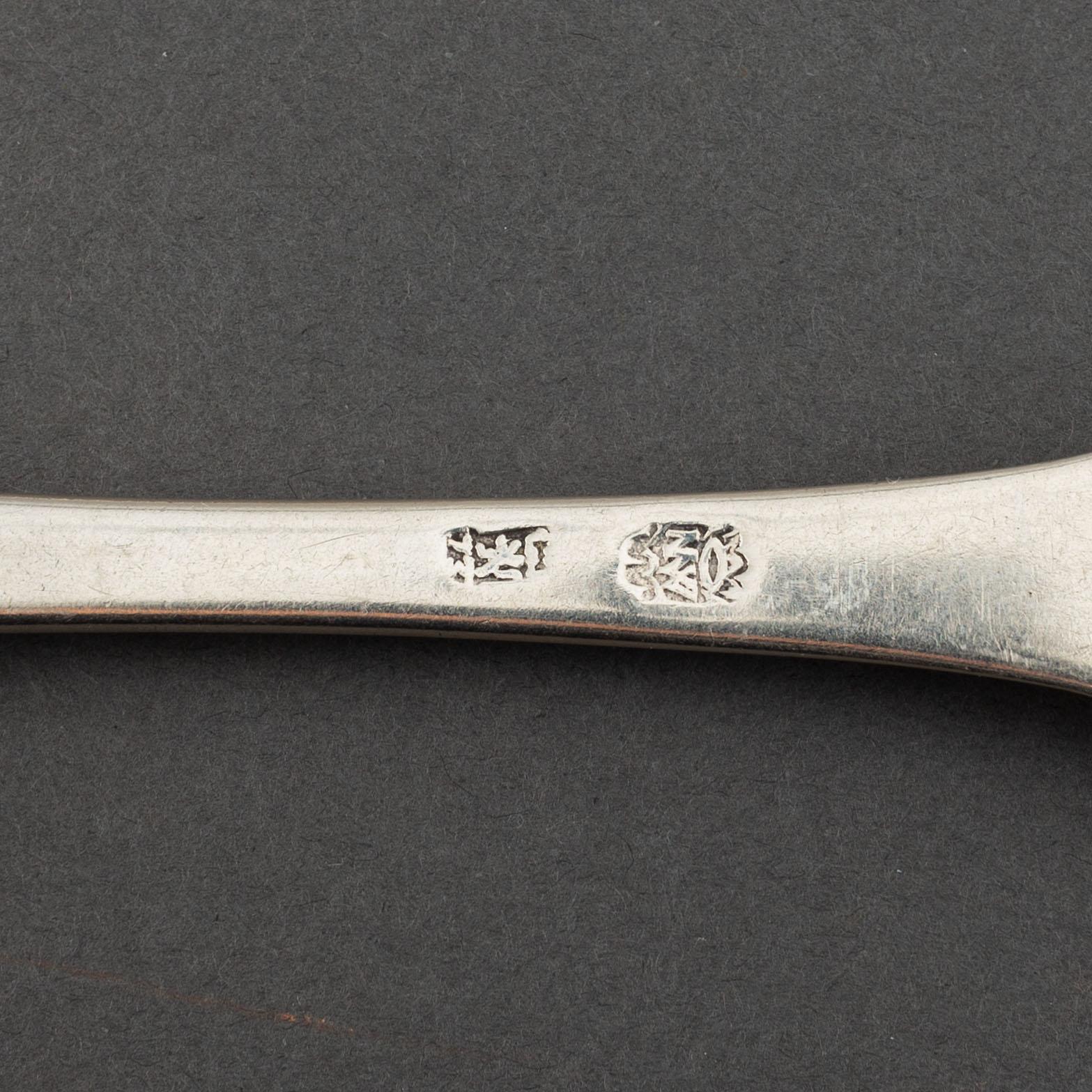A matched set of nine 18th century silver spoons, marked Basel and Naunur (Belgum).