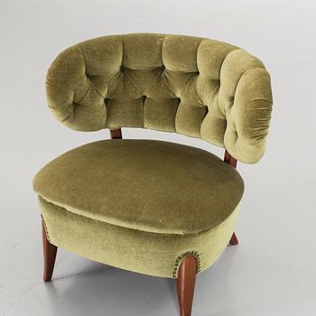 AN OTTO SCHULTZ LOUNGE CHAIR.