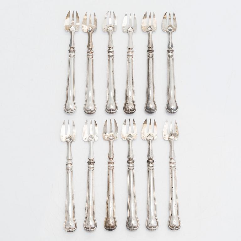 A 12-piece set of silver oyster forks, France mid-/ latter half of 19th century.
