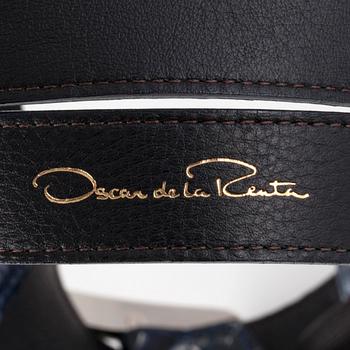 OSCAR DE LA RENTA, a blue snakeskin belt.