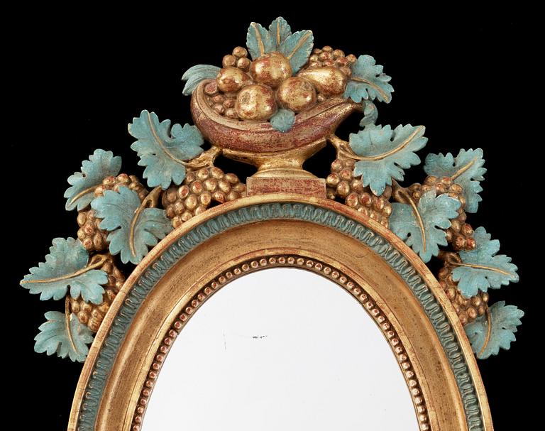 A pair of Swedish Empire two-light mirror girandoles.