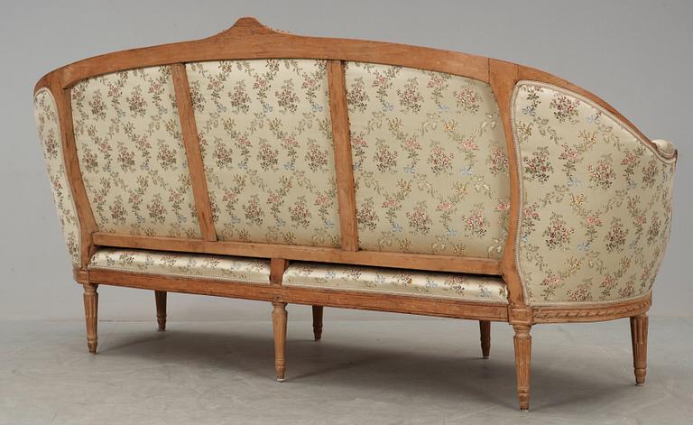 A Louis XVI 18th century sofa. Two later armchairs included.