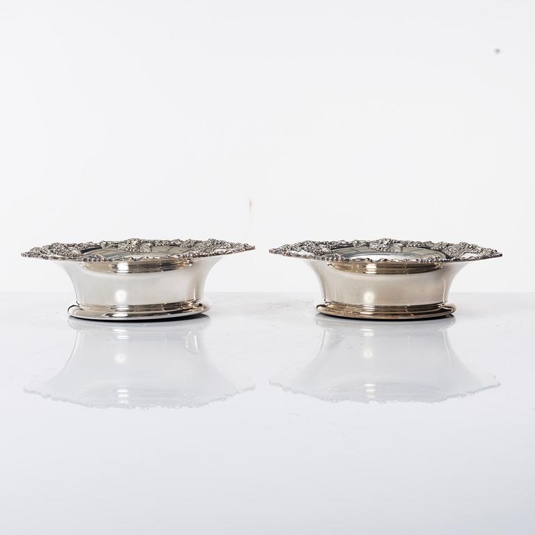 A pair of silver plated coasters, England 20th century.