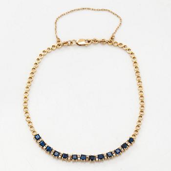Rannkoru, 14K kultaa, timantteja n. 0.12 ct yht ja safiireja.