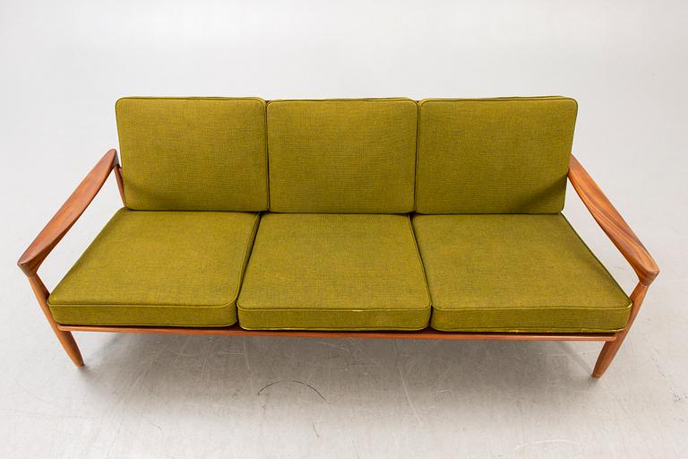 An Erik Wörtz 1962 walnut Kolding sofa for IKEA.