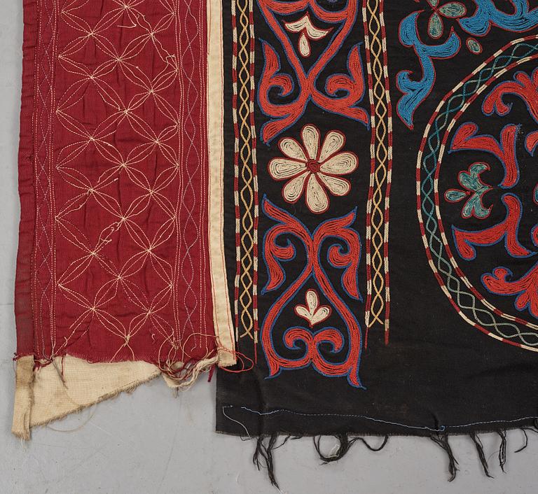A Suzani textile, ca 247 x 128 cm.