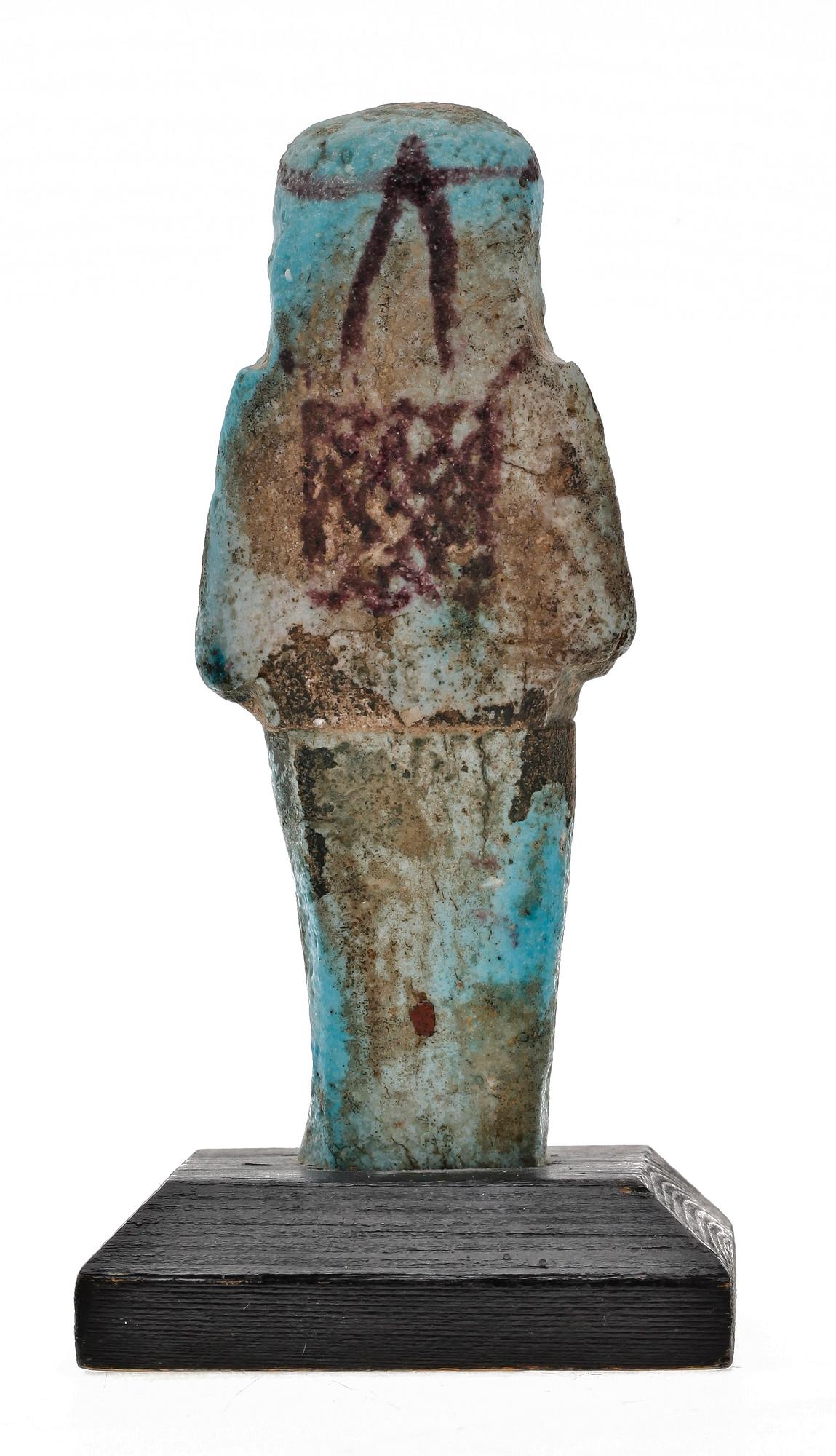 A faiance ushebeti, presumably 21 dynasty Egypt 1070-945 B C.
