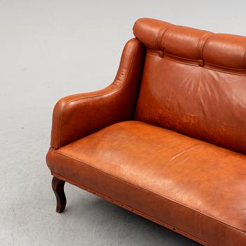 An early 20th century leather sofa.