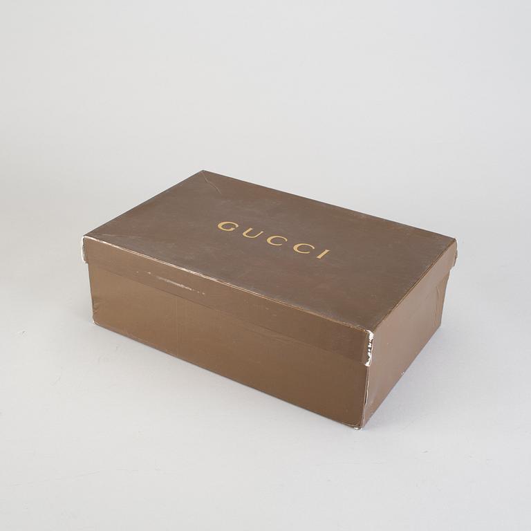 A pair of hight-top Gucci sneakers, european size 42.