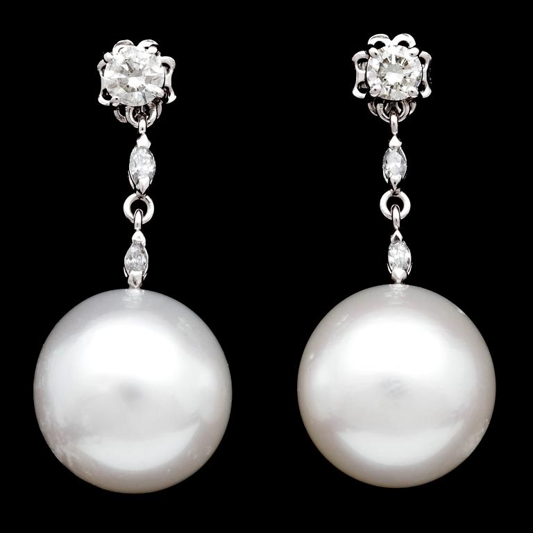 A pair of cultured South sea pearl, 15,4 mm, and diamond earrings, tot. app. 1. cts.