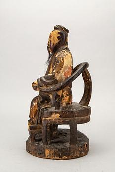 A Chinese late Qing painted wooden sculpture.