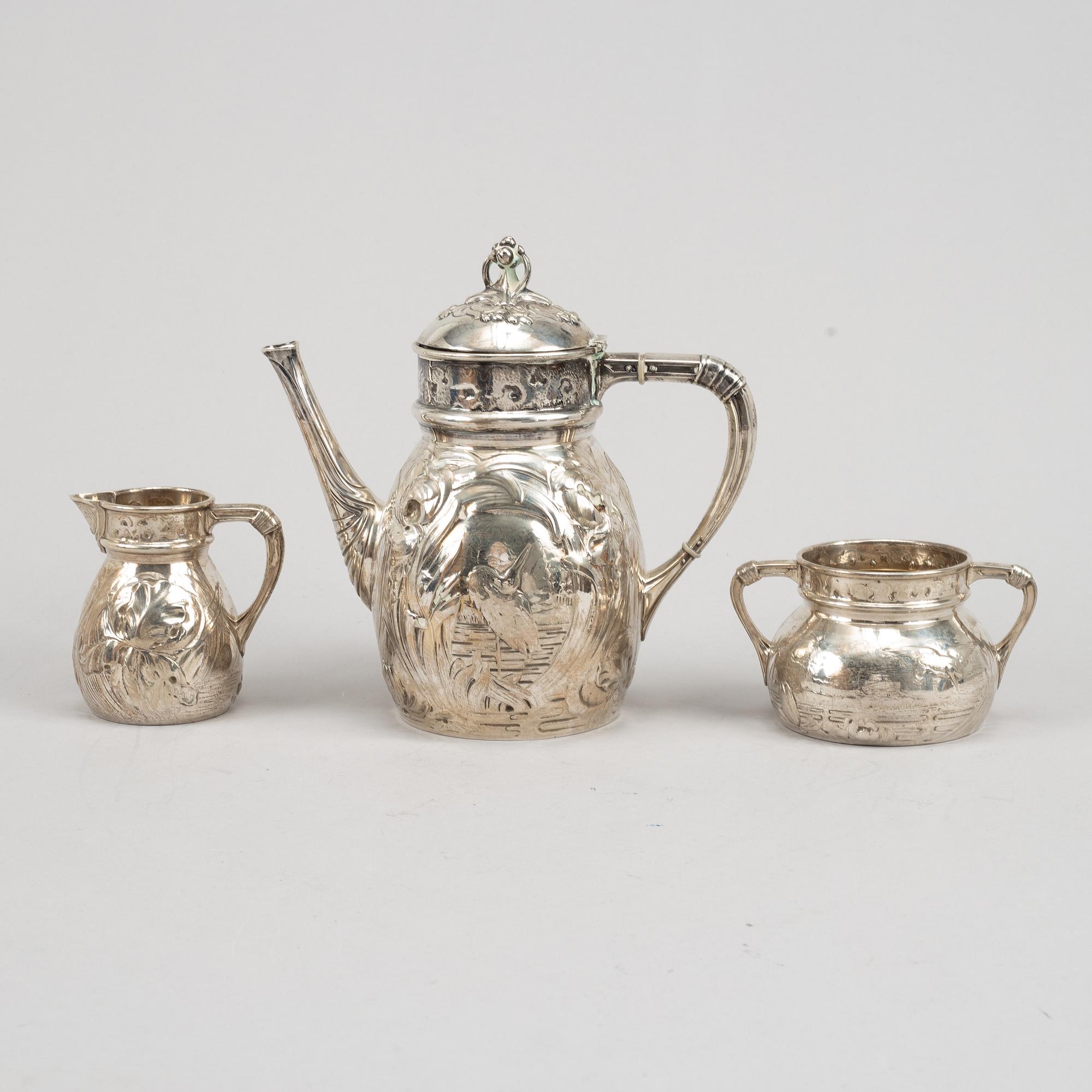 A Swedish silver coffee pot, creamer and sugar bowl, mark of Emil Oscar Möller, Malmö 1907.