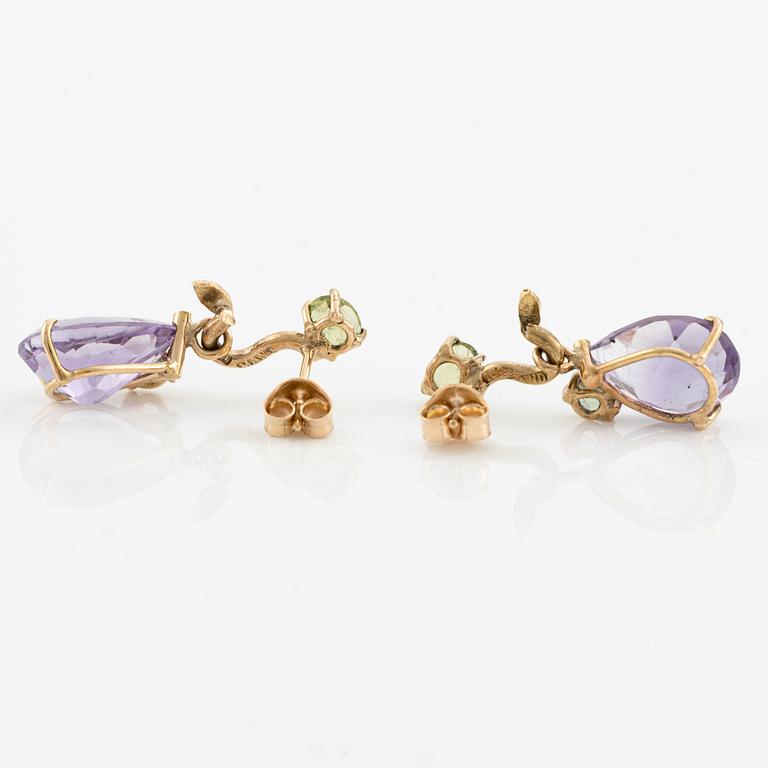 Earrings with drop-shaped faceted amethysts, peridot, and small diamonds.