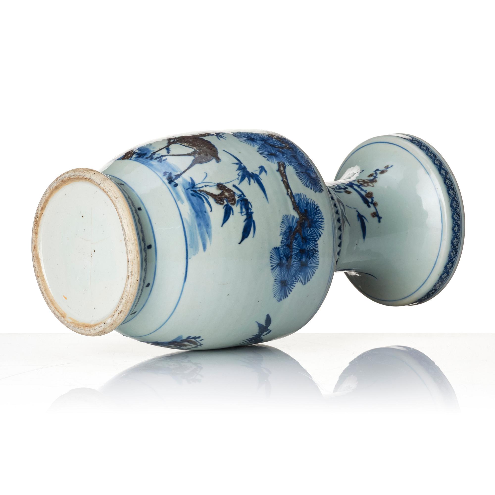 A blue and white and iron red vase. Qing dynasty, 19th century.