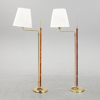 A pair of brass and leather floor lights, Örsjö industri, 21st century.