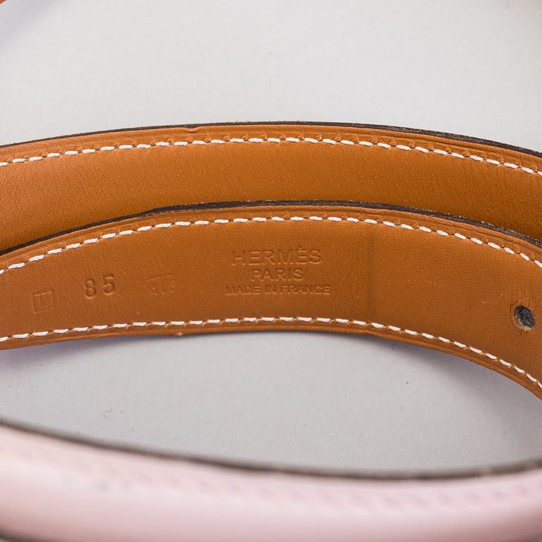 A REVERSIBLE LEATHER BELT, size 85.