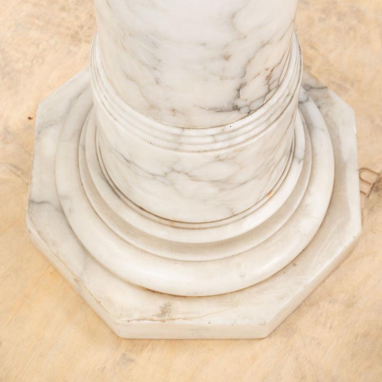 A marble pedestal, early 20th Century.