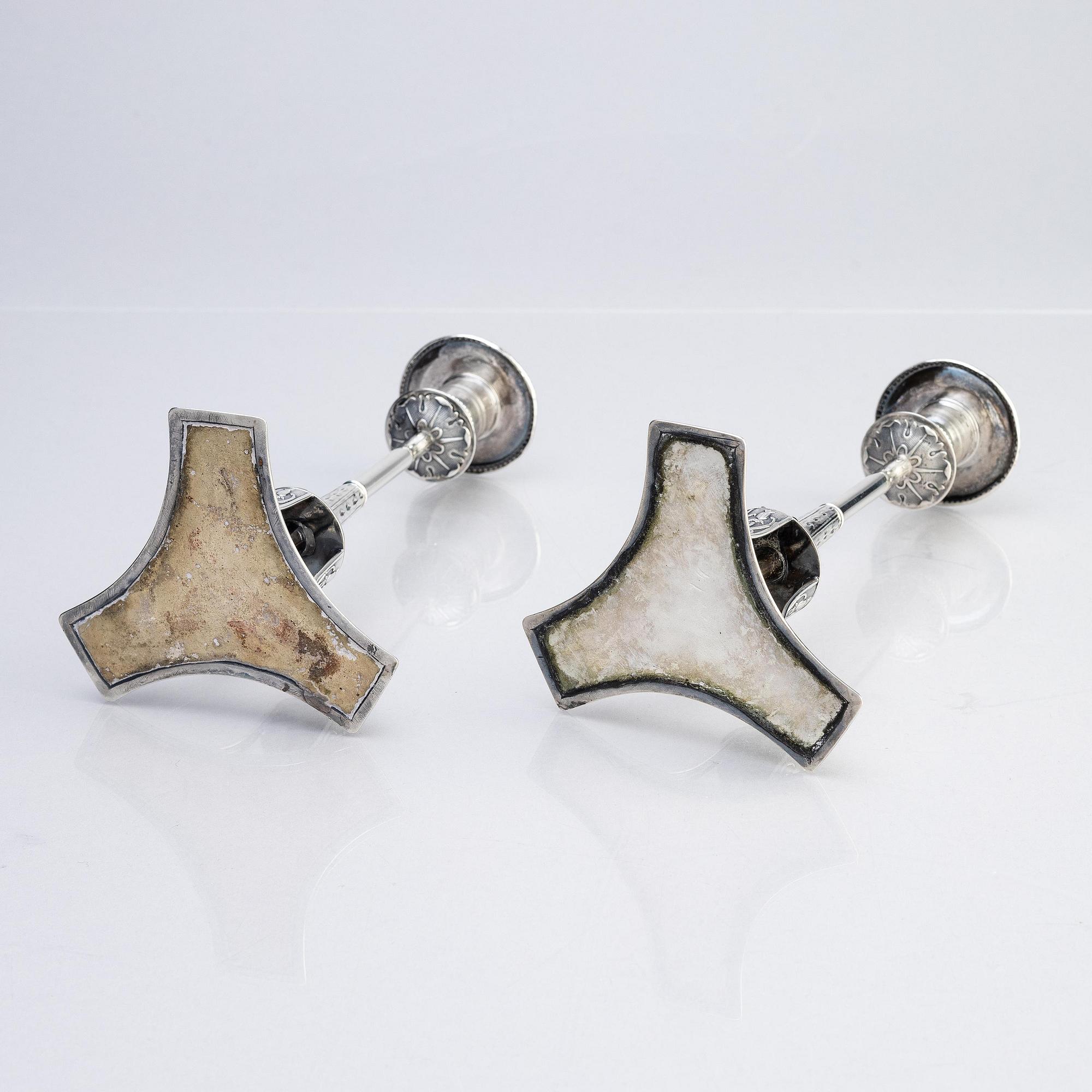 A pair of Swedish early 19th century silver candlesticks, marks of Adolf Zethelius, Stockholm 1817.