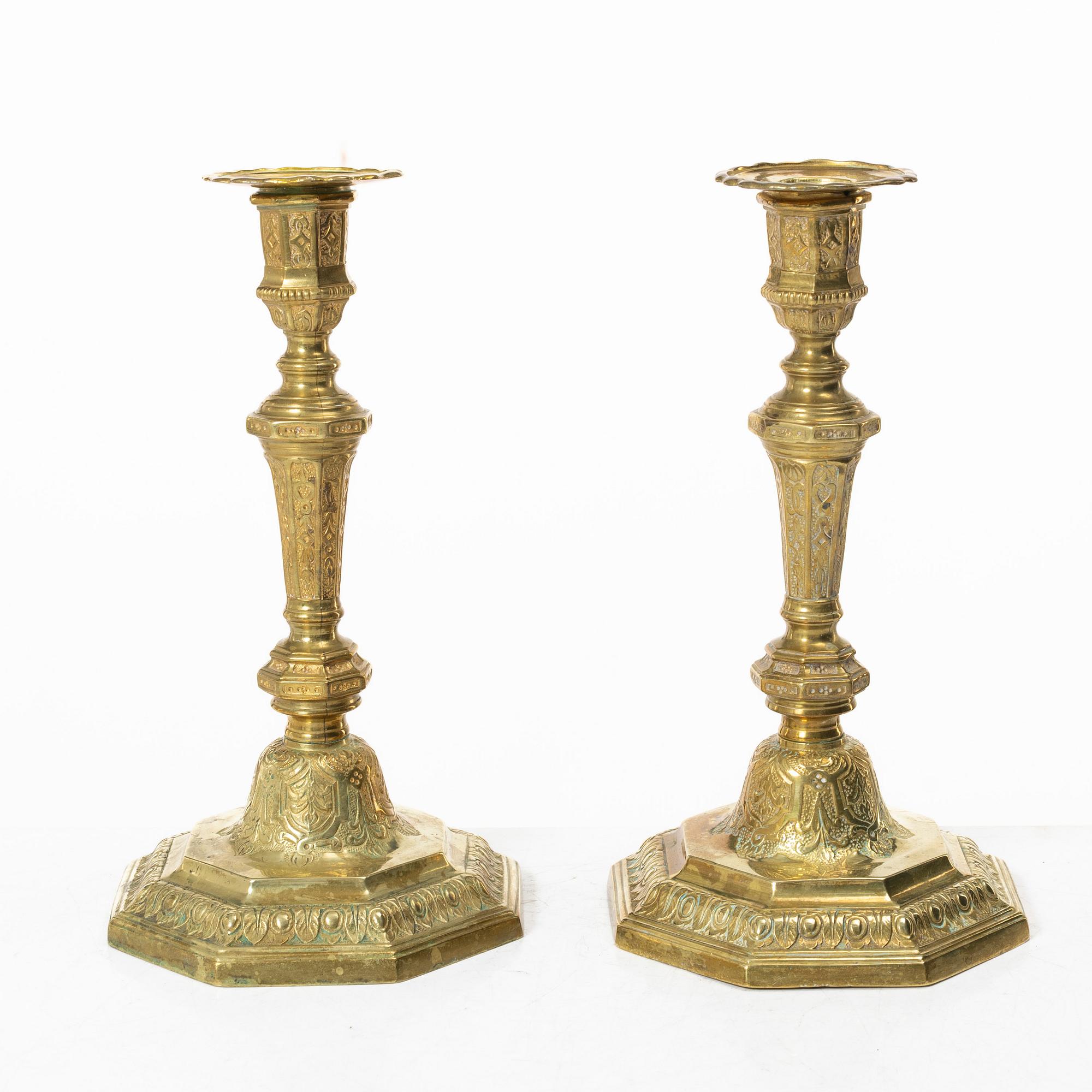 A pair of Louis XVI-style brass candle sticks, first half of the 20th century.