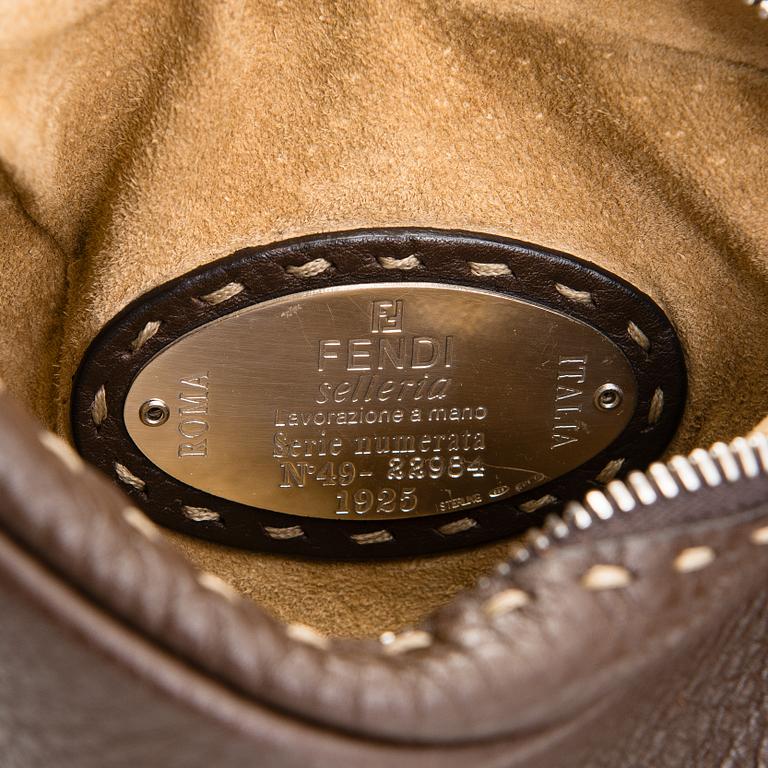 Fendi, a brown leather bag.