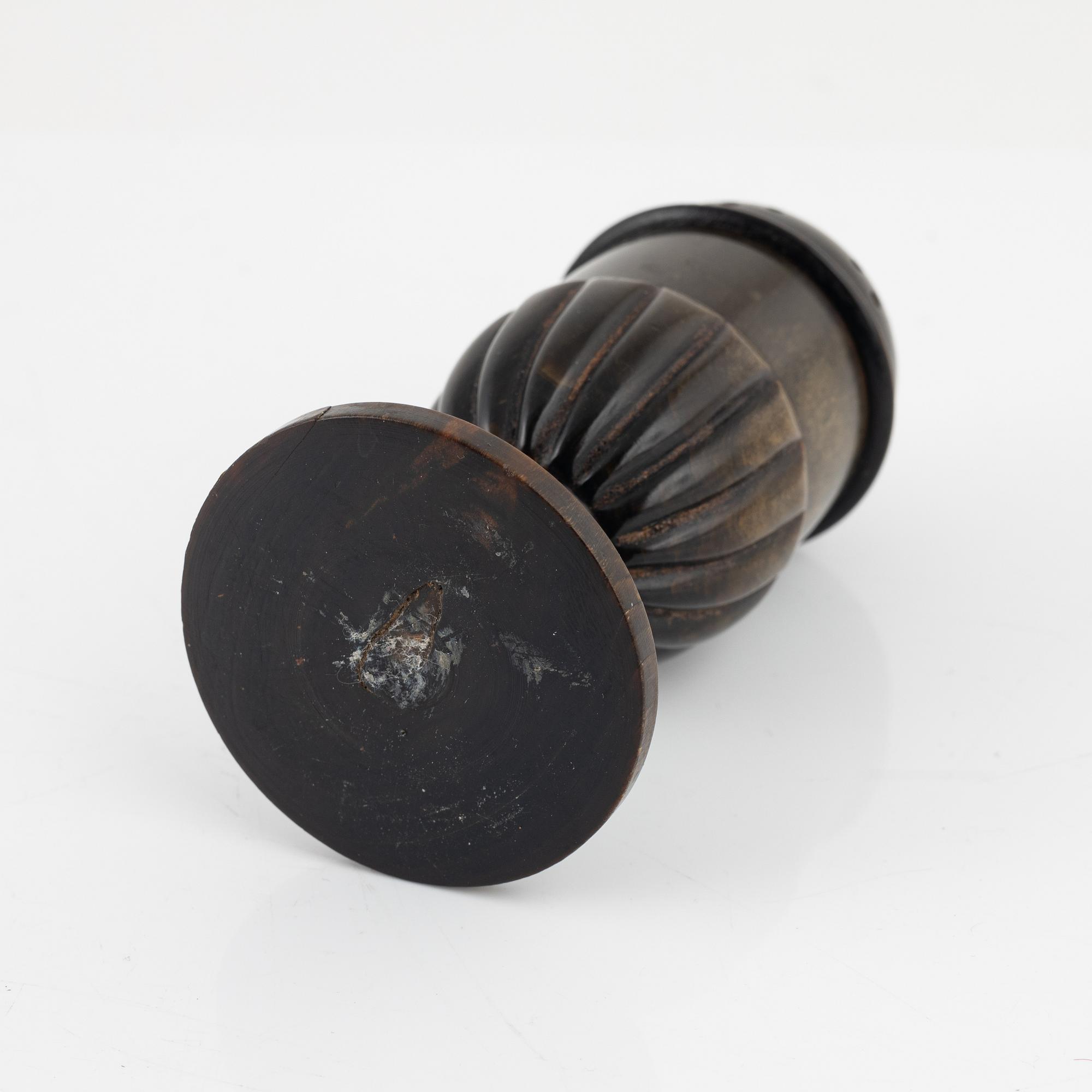 A 18th Century horn saltshaker.