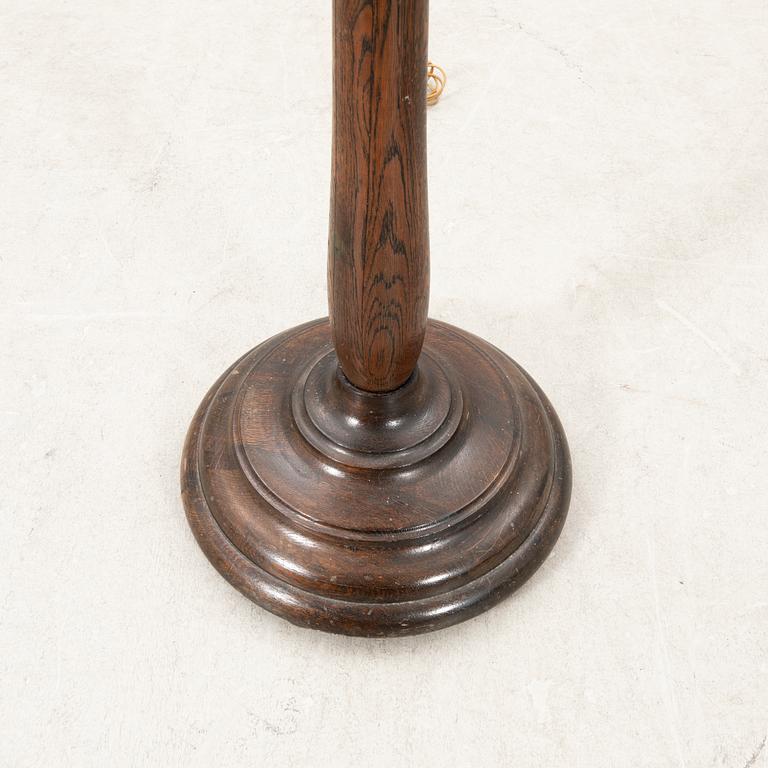 An early 1900s oak floor lamp.