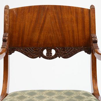 A pair of Baltic / Russian mahogany Empire armchairs, first part 19th century.