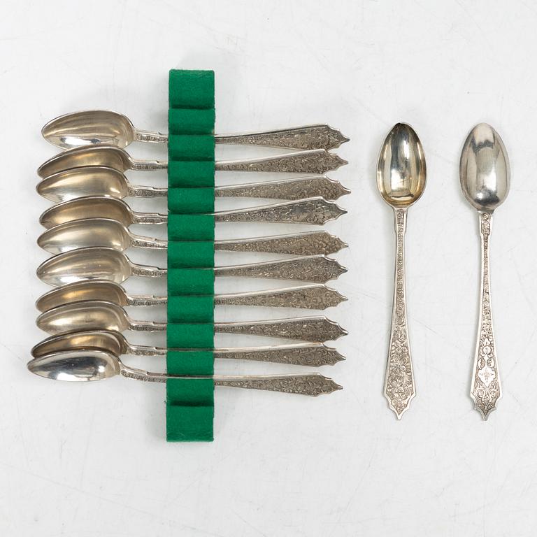A Persian silver tray, 12 small spoons and six coasters, first part of the 1900s.