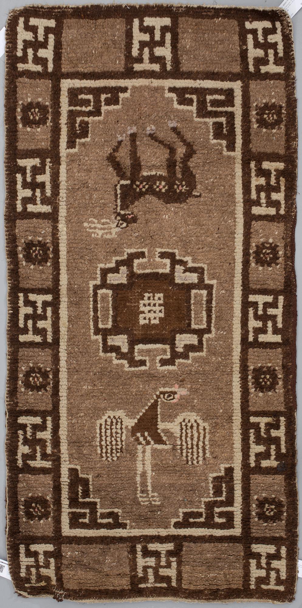 A RUG, a semi-antique Tibetan probably, ca 158 x 78 cm.