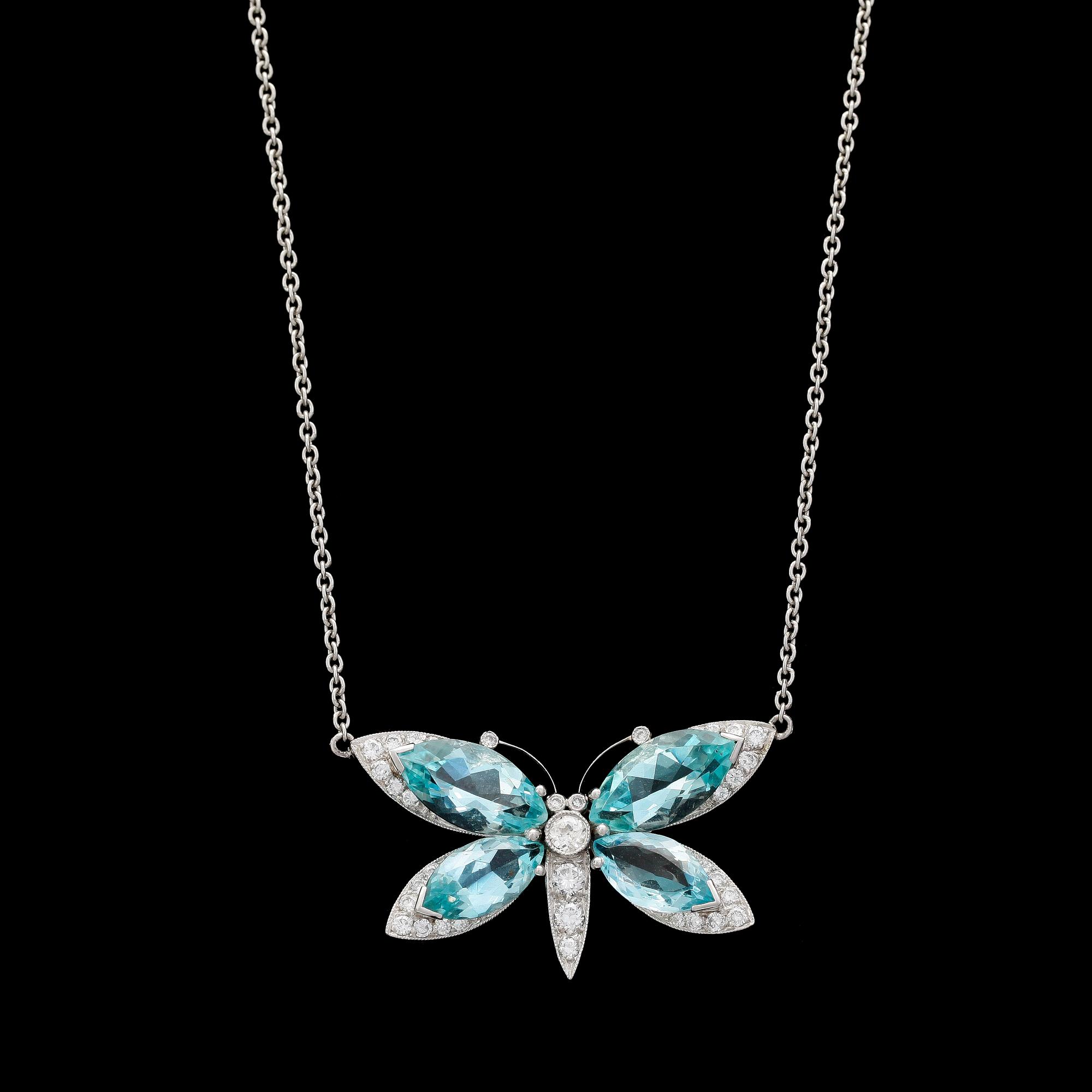 PENDANT, butterfly, with aquamarine and brilliant cut diamonds.