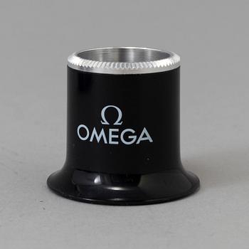 OMEGA, Pen / Loupe / Velcro strap.