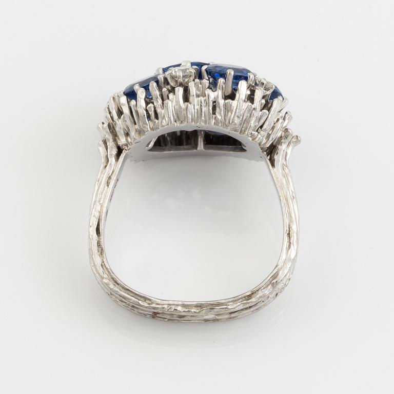 A WA Bolin ring in 18K white gold set with sapphires and round brilliant-cut diamonds.