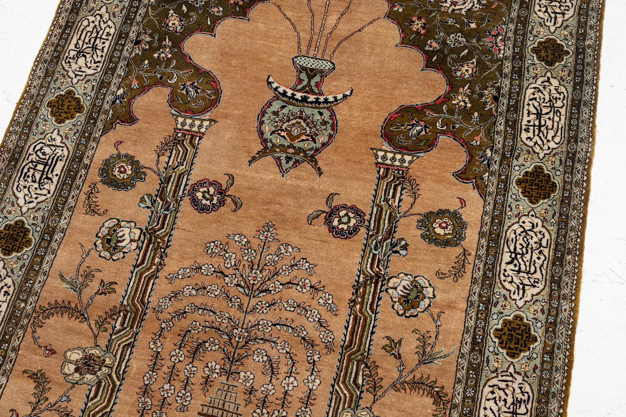 A silk Quum rug, c. 155 x 103 cm.