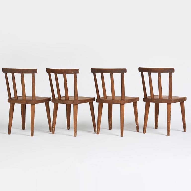 Axel Einar Hjorth, a set of four stained pine "Utö" chairs, Nordiska Kompaniet, Sweden 1930s.