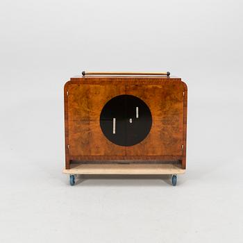 A walnut veneered Art Déco cabinet from the first half of the 20th century.