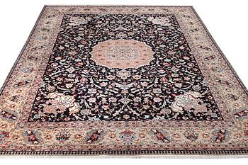 A semi.antique Tabriz carpet, 50 raj, c. 390 x 290 cm.