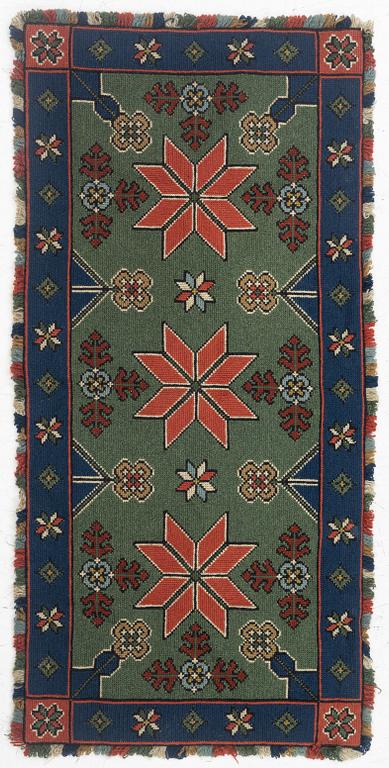 A Scania cross-stitch embroidered cushion, Sweden, around 1900, c. 99 x 47 cm.