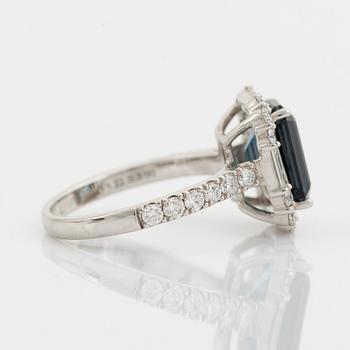 Blue topaz and baguette and brilliant cut diamond ring.