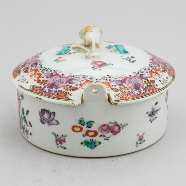 A famille rose butter tureen with cover and two cups with three odd stands, Qing dynasty, Qianlong (1736-95).